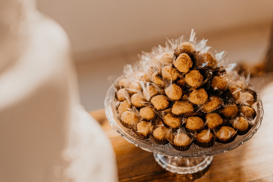 A pyramid of brigadeiros elegantly arranged on a decorative stand, perfect for a party or celebration.