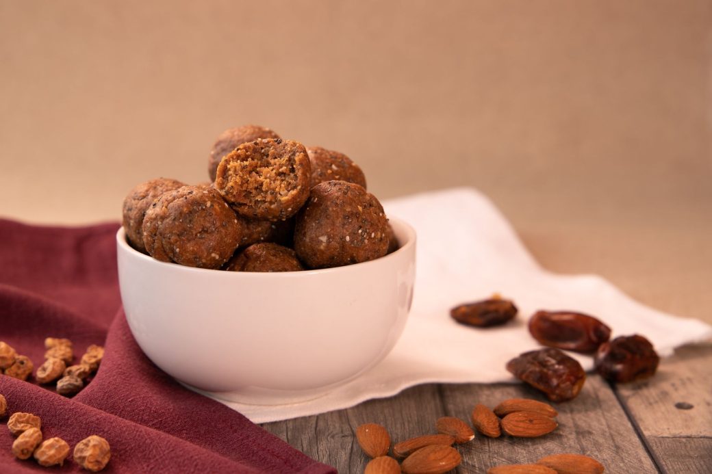 A delicious and healthy bowl of energy balls made with nuts and dates, perfect for a nutritious snack.